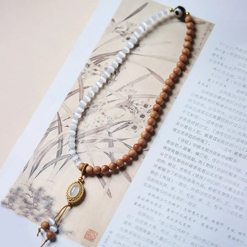 Sandalwood and opal double ring bracelet with polished finish and retro style.