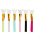 Reusable silicone face and body mask applicator spatula in various colours for applying clay and mud masks.
