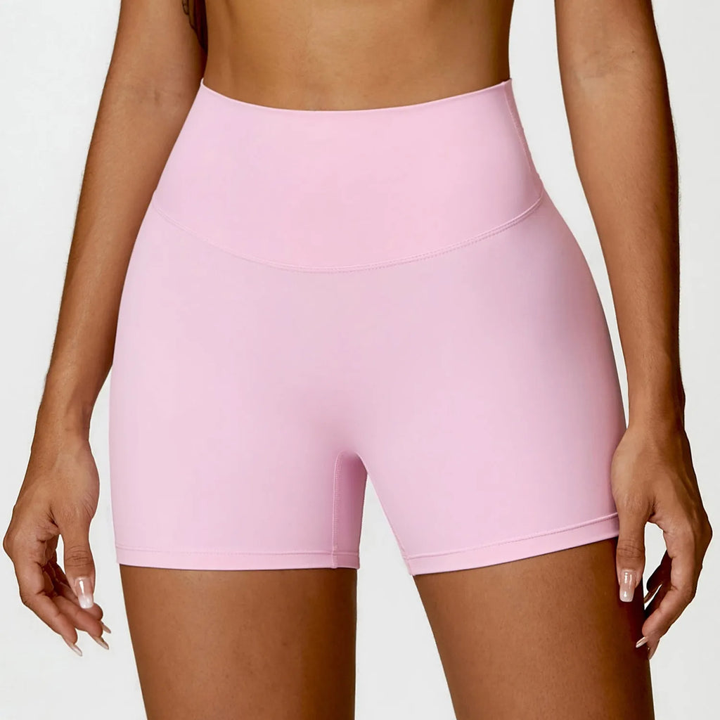 Women's high waist yoga shorts in basil green, showing contoured fit and hip-lifting design for sport.