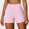 Women's high waist yoga shorts in basil green, showing contoured fit and hip-lifting design for sport.