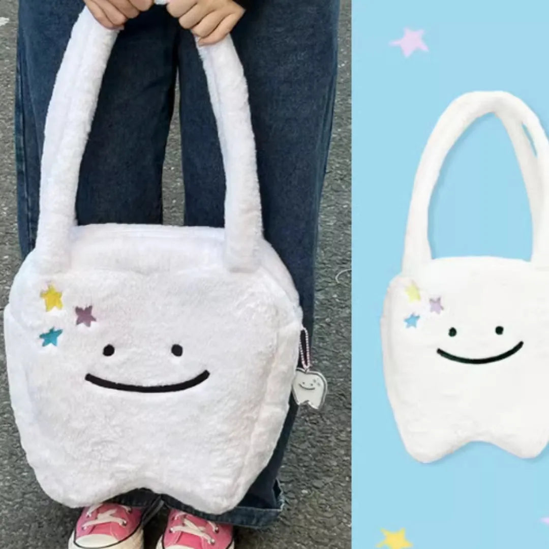 White plush shoulder tote bag with large tooth design and crossbody strap