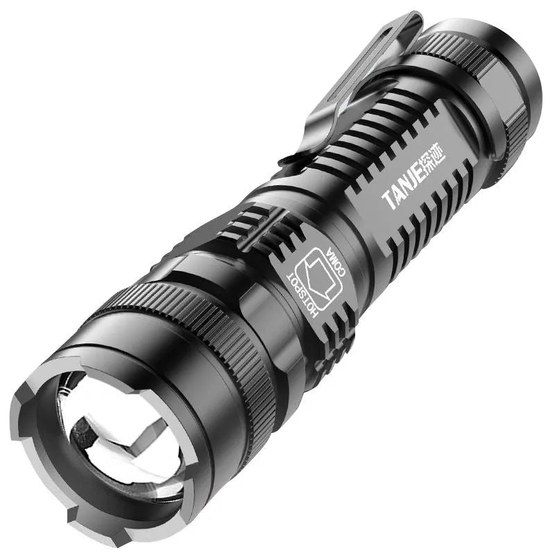 Black aluminium telescopic LED flashlight with zoom adjustment and clip for carrying