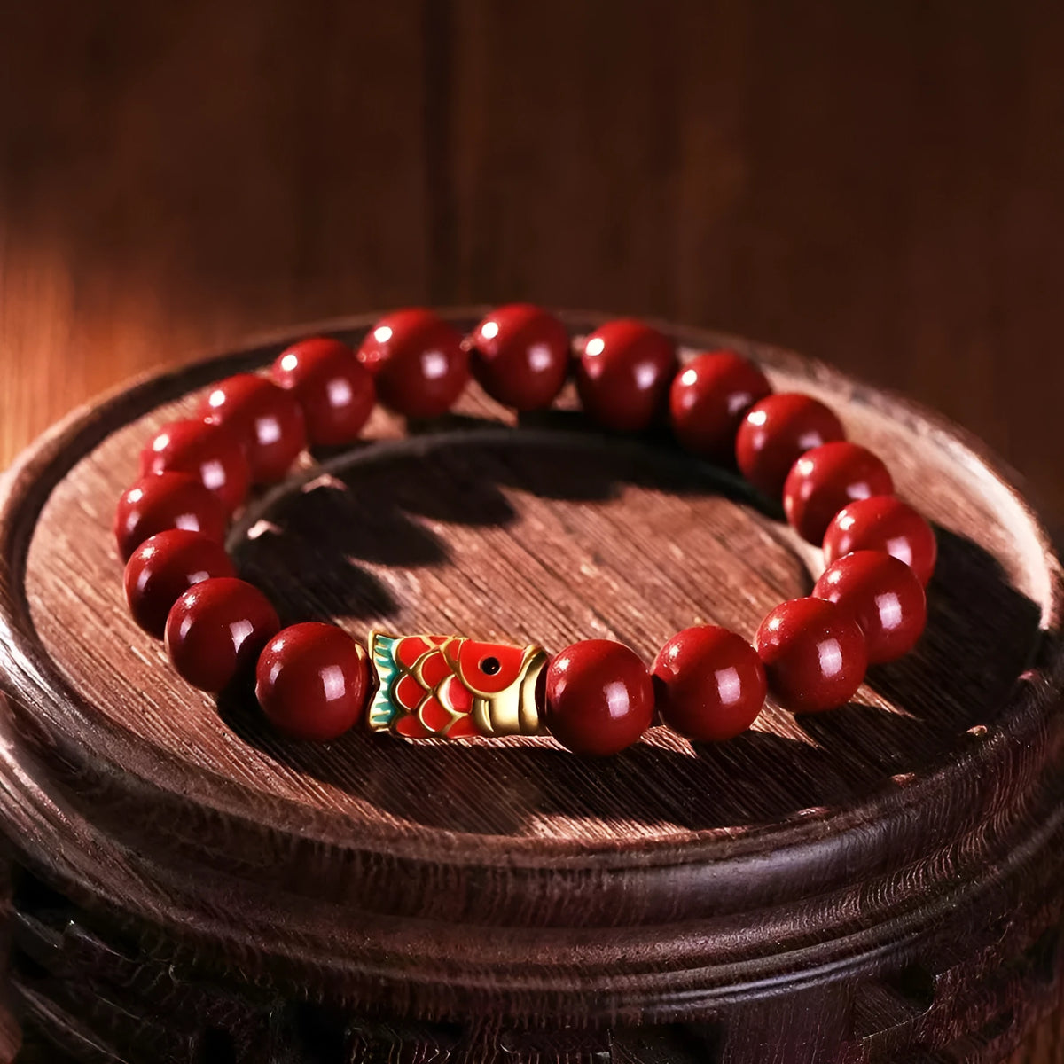 Traditional Chinese cinnabar koi bracelet with natural raw ore materials and golden ball design in 4mm or 6mm sizes