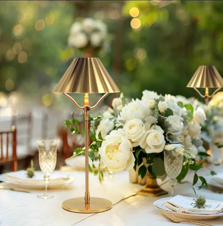 Gold-coloured alloy desk lamp with USB charging port and touch-sensitive control.
