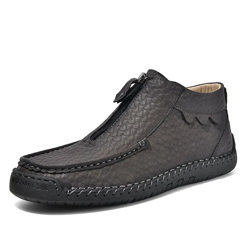 Men's black slip-on loafers with a round toe and rubber sole, shown in a casual style.