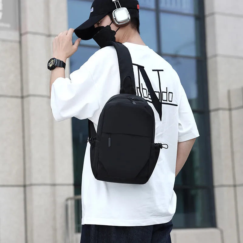 Men's grey lightweight chest bag showing shoulder strap and front compartment