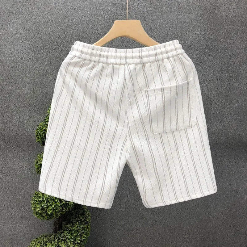 Men's black and white striped fleece-lined casual shorts with an ankle band and double waistband.