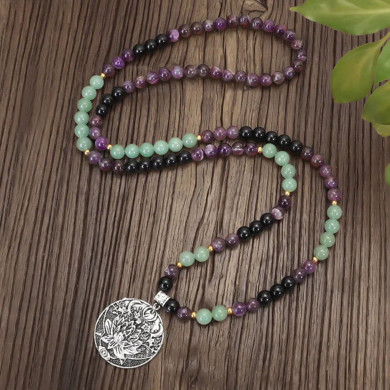 Dongling Long handmade stone bead necklace with alloy lotus pendant and matching bracelet.