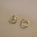 Pair of S925 sterling silver earrings with 14k gold plating featuring a smooth fishtail design and 8mm inner diameter