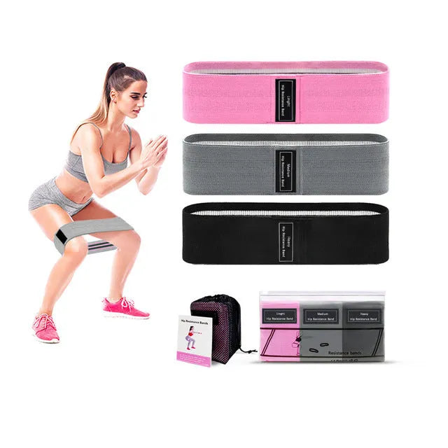 Three fabric resistance bands in lake blue, pink and purple colours with mesh storage bag