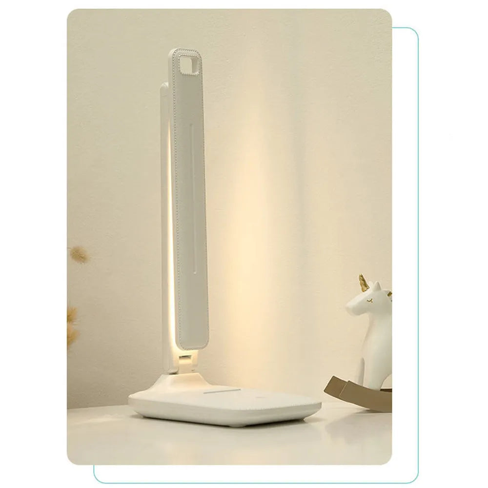 White plastic touch dimming bedside table lamp with USB charging port.