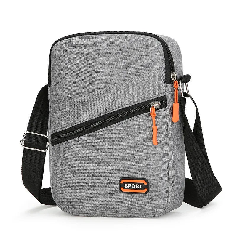 Ultra-light Oxford cloth crossbody commuter bag in solid colour with contrast trim.