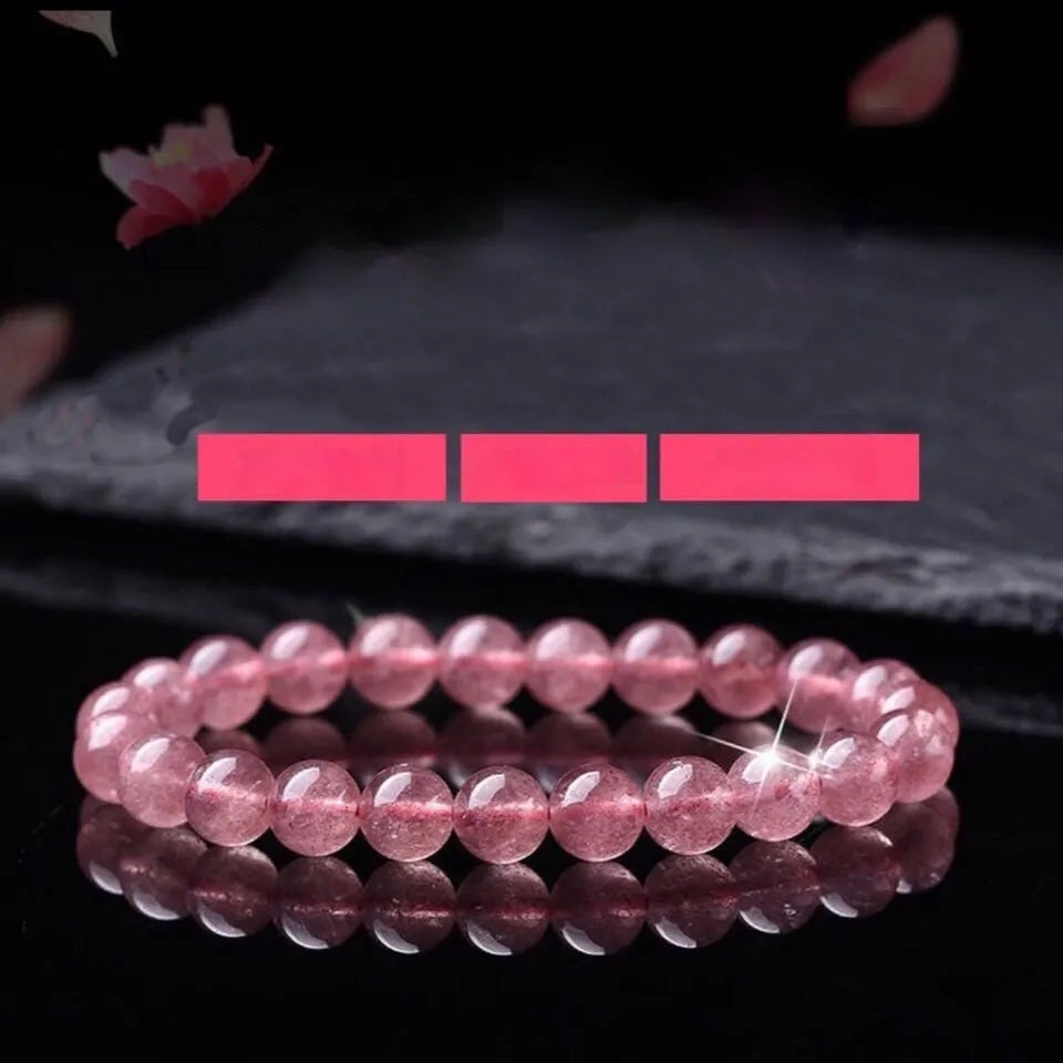 Women's strawberry quartz crystal bracelet with polished beads in 6mm, 8mm, or 10mm sizes