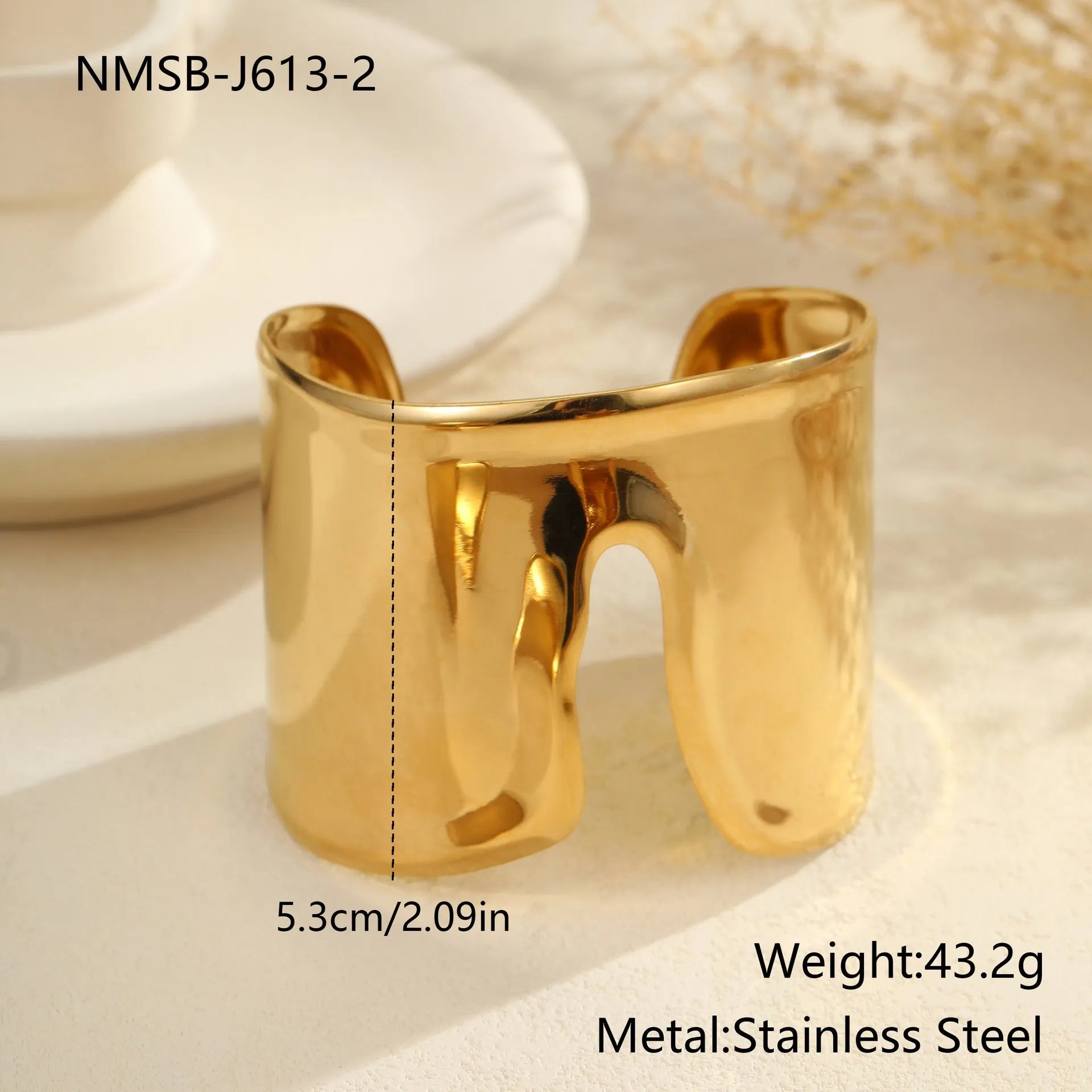 Gold plated stainless steel bracelet with exaggerated wide geometric wave design and asymmetric opening