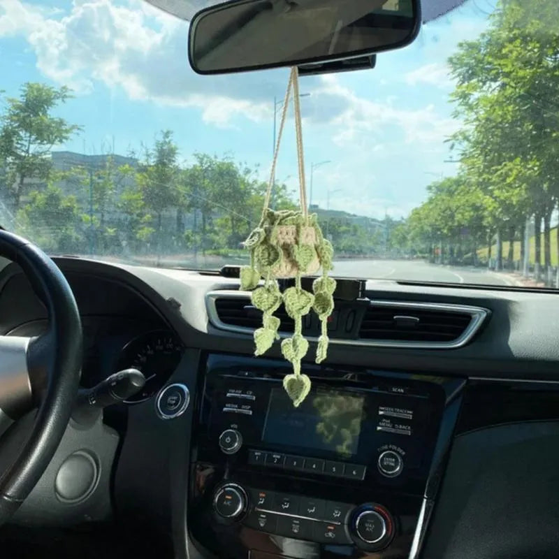 Green and white knitted wool car plant decoration with plastic base and hanging rope