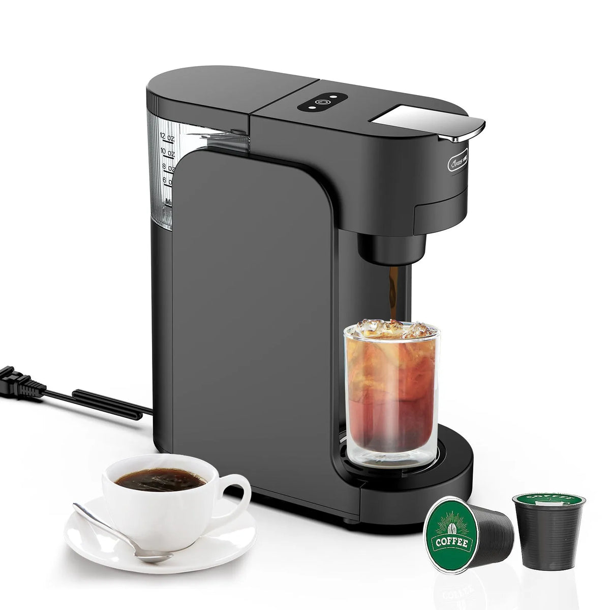 Black and white compact capsule coffee machine on a counter with adjustable drip tray and transparent water tank