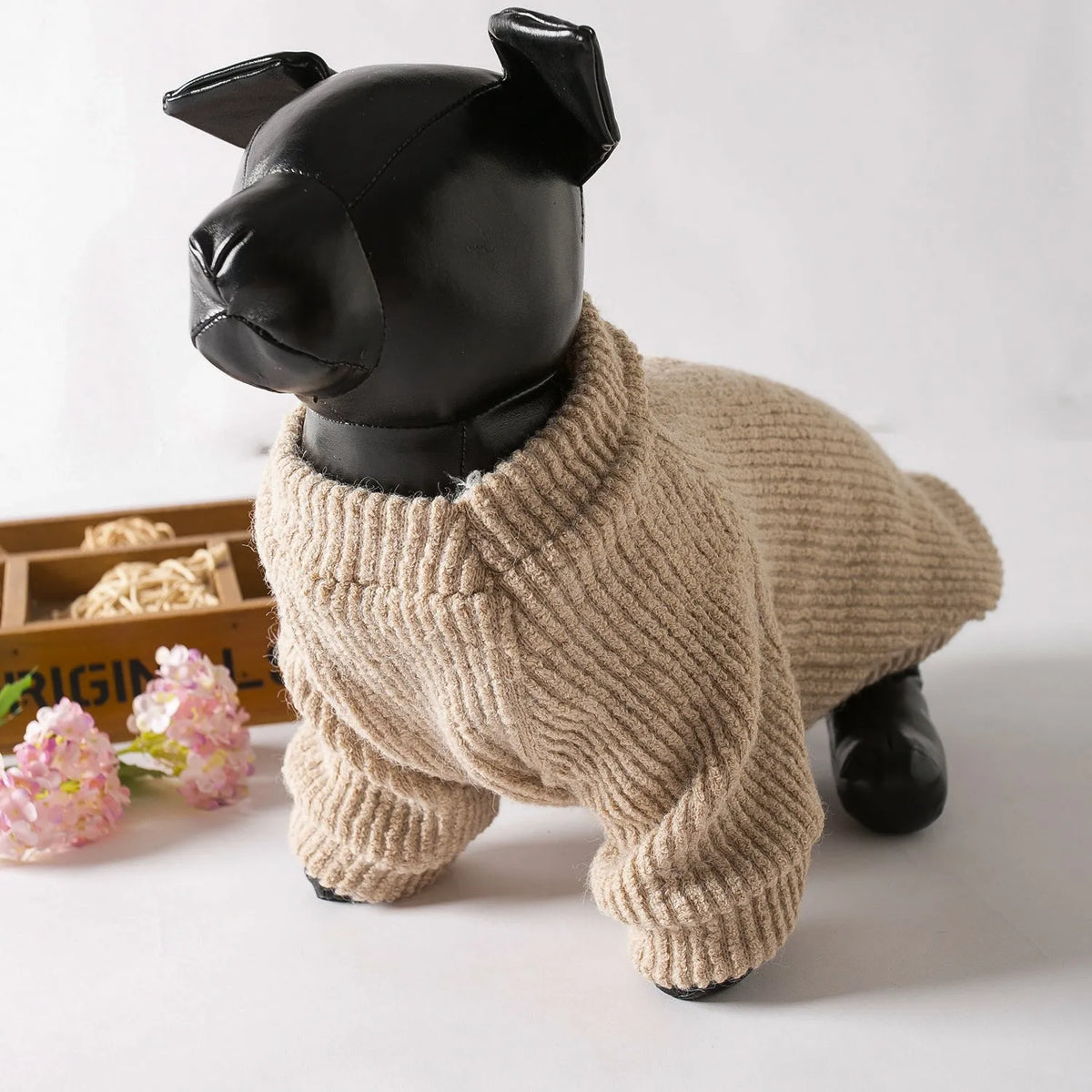 Brown cloth dog sweater pullover on a small white dog, showing casual style.