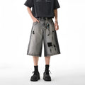 Grey washed denim shorts with distressed holes, loose-fit cropped design for summer casual wear