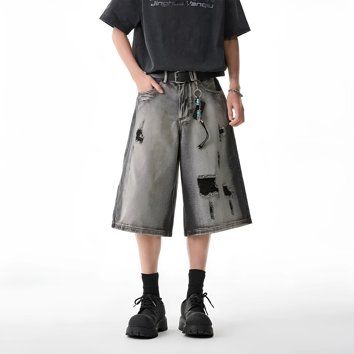 Grey washed denim shorts with distressed holes, loose-fit cropped design for summer casual wear