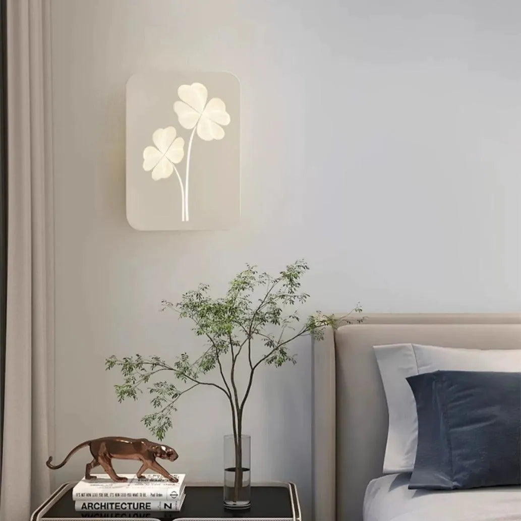 Modern cream bedside wall lamp with tricolour LED light and acrylic shade in love heart design