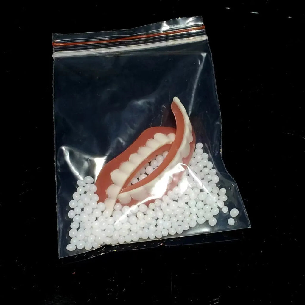 Silicone simulation dentures showing upper and lower teeth configuration in colour-coded box