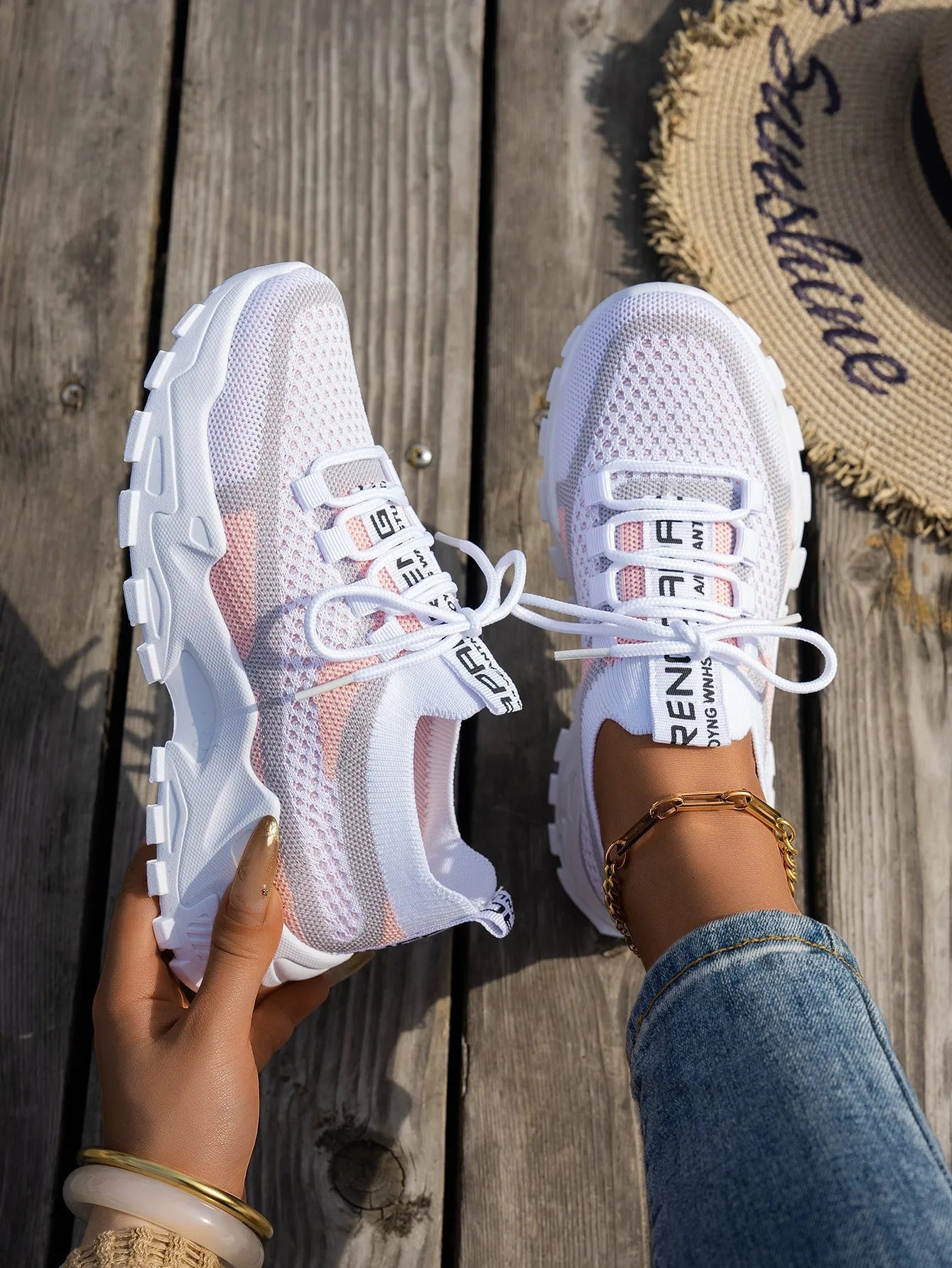 Women's flyknit mesh sneakers with rubber sole and lace-up design in black and gray