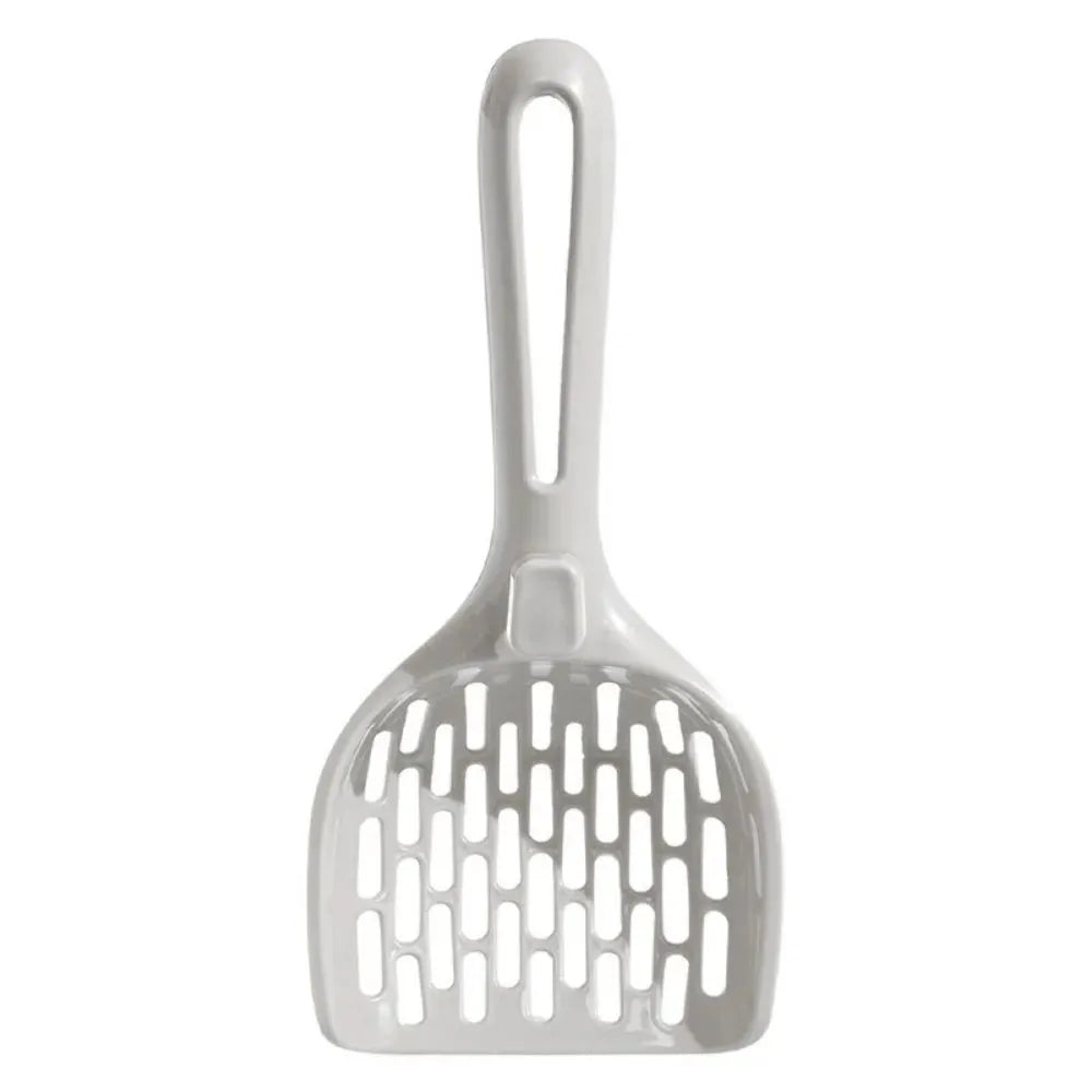 Grey plastic cat litter scoop with drainage holes resting on matching base unit