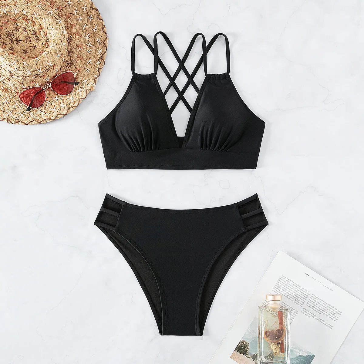 Ladies' black V-neck halter bikini swimsuit with adjustable ties and matching briefs.