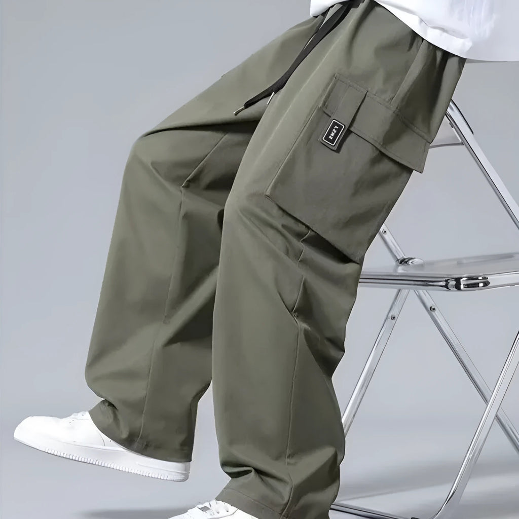 Boys cargo pants with drawstring waist and large side pockets in polyester fabric