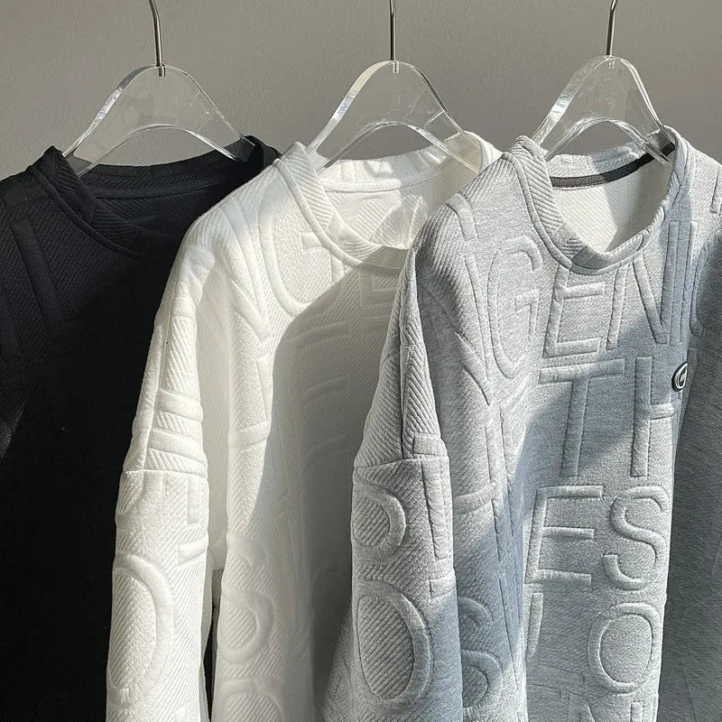 Men's gray short sleeve t-shirt with a raised three-dimensional black letter print, showing a loose retro fit.
