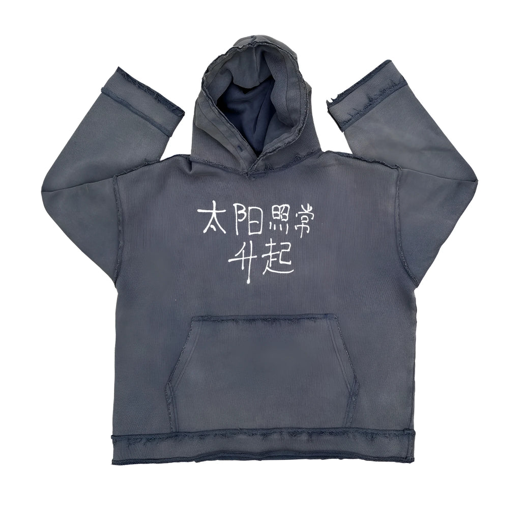 Man wearing a dark blue full zip hoodie sweater.