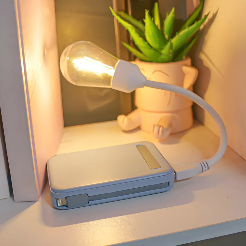 USB rechargeable folding tungsten filament night light in extended position showing warm white illumination