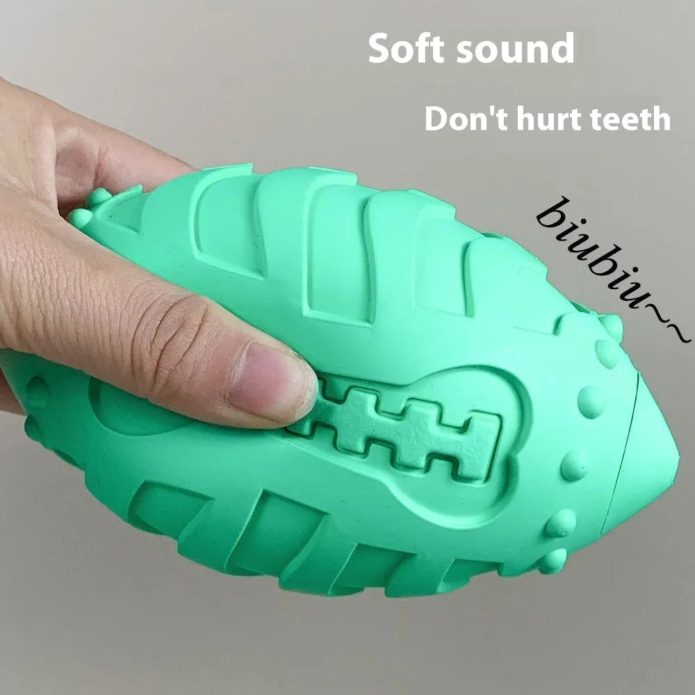 Thickened rubber rugby ball dog toy in light green or sapphire blue for interactive training