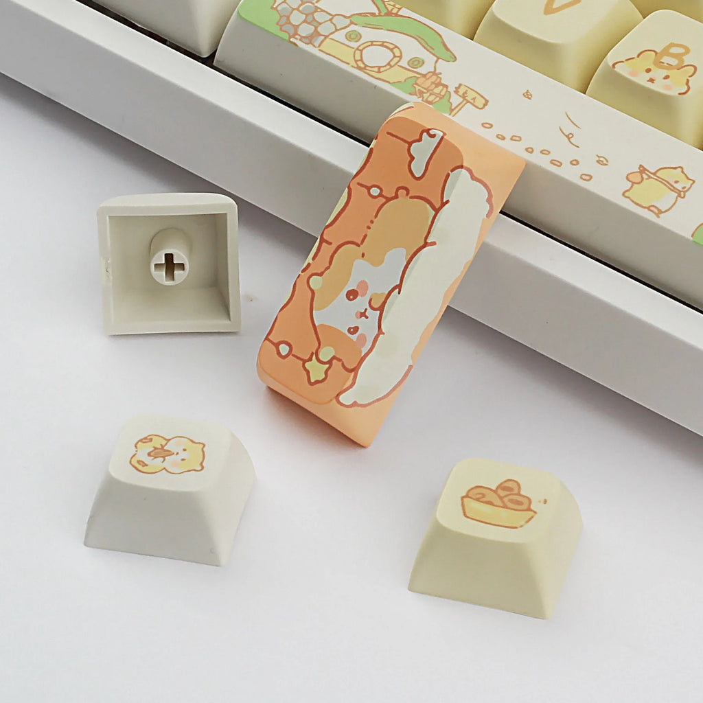 XDA profile mechanical keyboard keycaps in custard colour with mouse grey and yellow designs