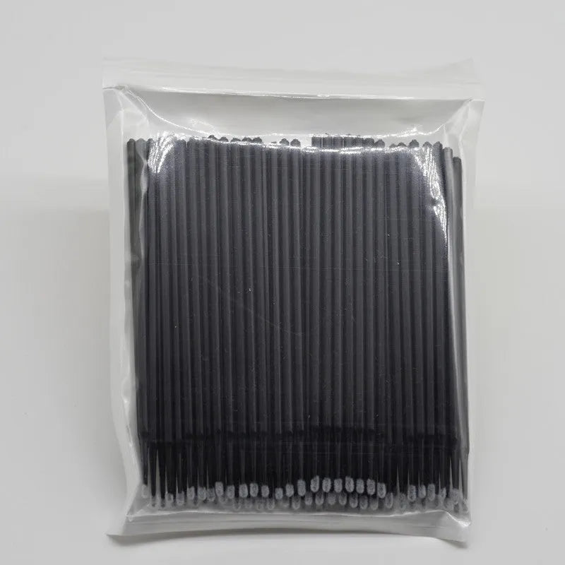 Disposable micro applicator brushes with bendable cotton tips and colour-coded handles for eyelash extensions