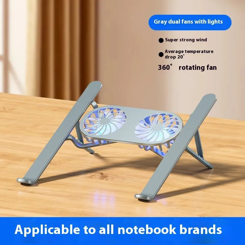 Silver aluminium folding laptop stand with twin cooling fans deployed on a desk.