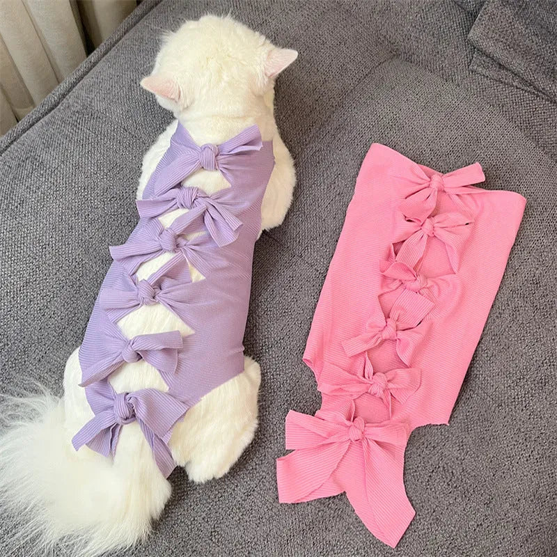 Lace-up polyester cat recovery suit for post-surgery care in blue, shown on a cat mannequin.