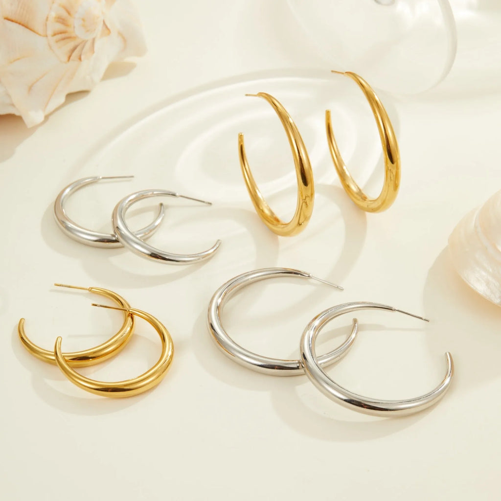 Titanium steel hoop earrings with geometric round design in gold and steel finish options