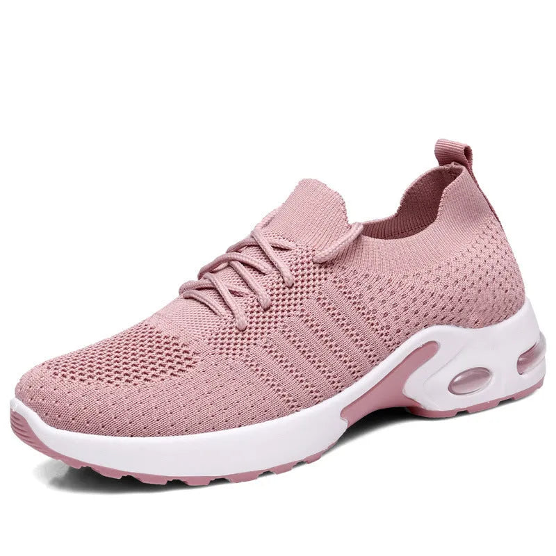 Women's black mesh casual sneaker with a round toe and white non-slip PVC sole on a light background.