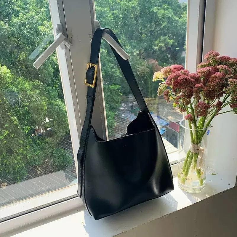 Soft PU leather ladies shoulder bag with swing threads in black or brown