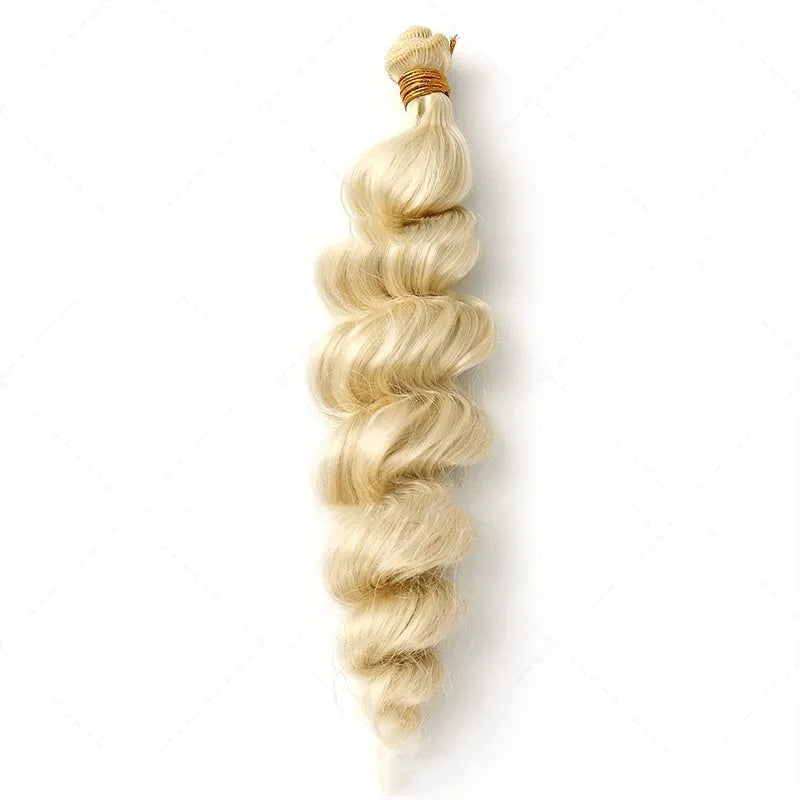 Golden coloured synthetic hair weft wig for women on a stand.