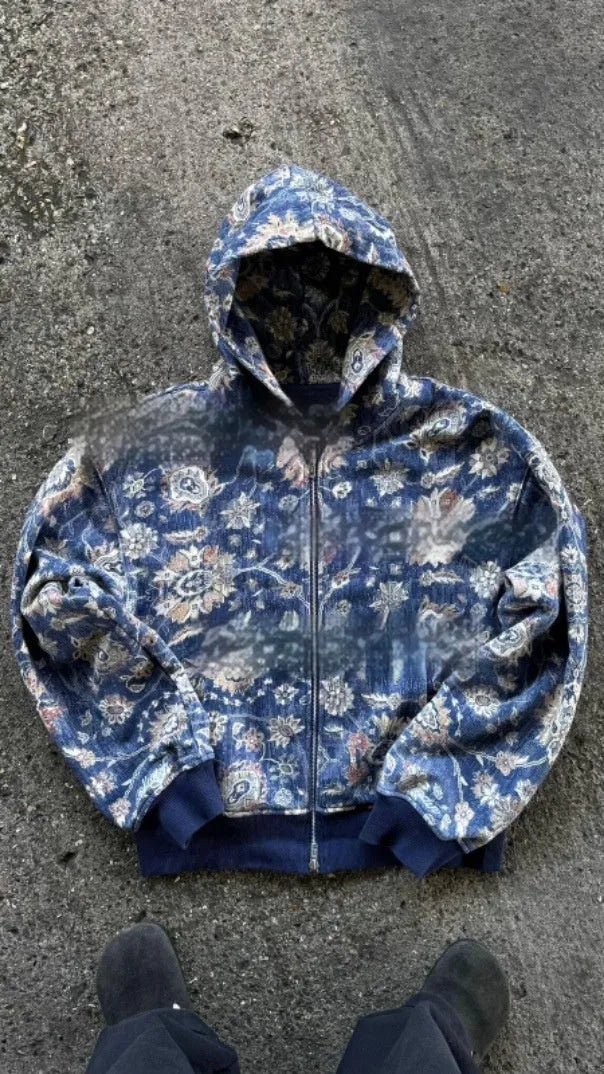 A man's loose-fitting blue hooded zip coat with long sleeves, shown front-on.