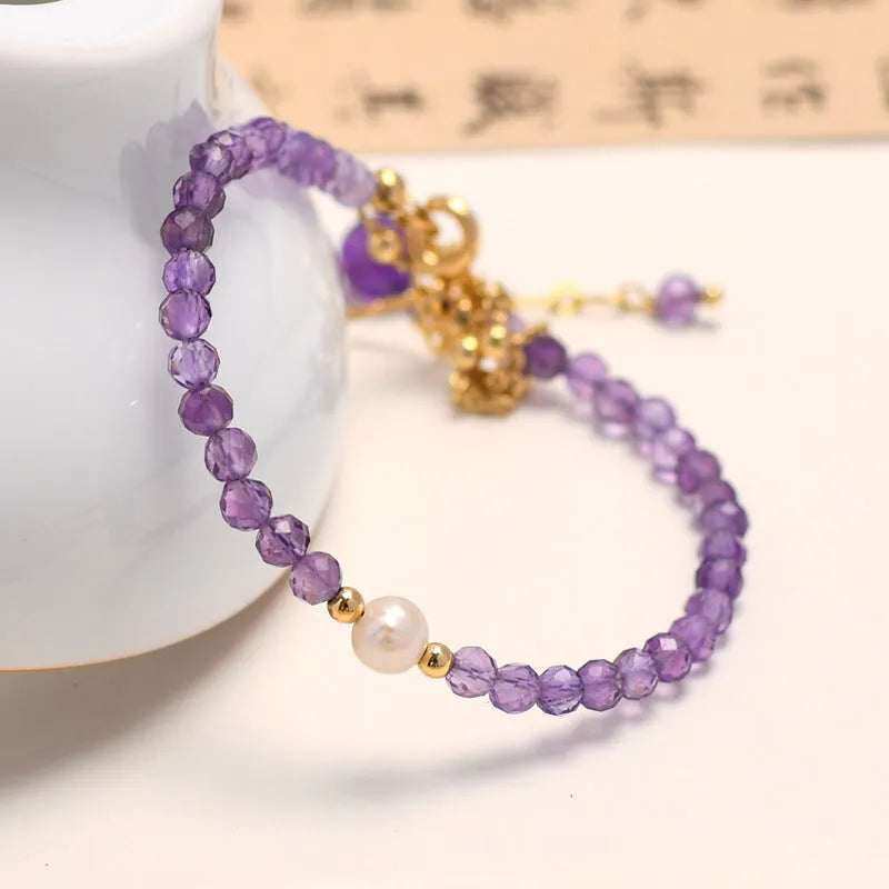 Women's amethyst crystal bracelet with diamond-cut beads in Chinese style design