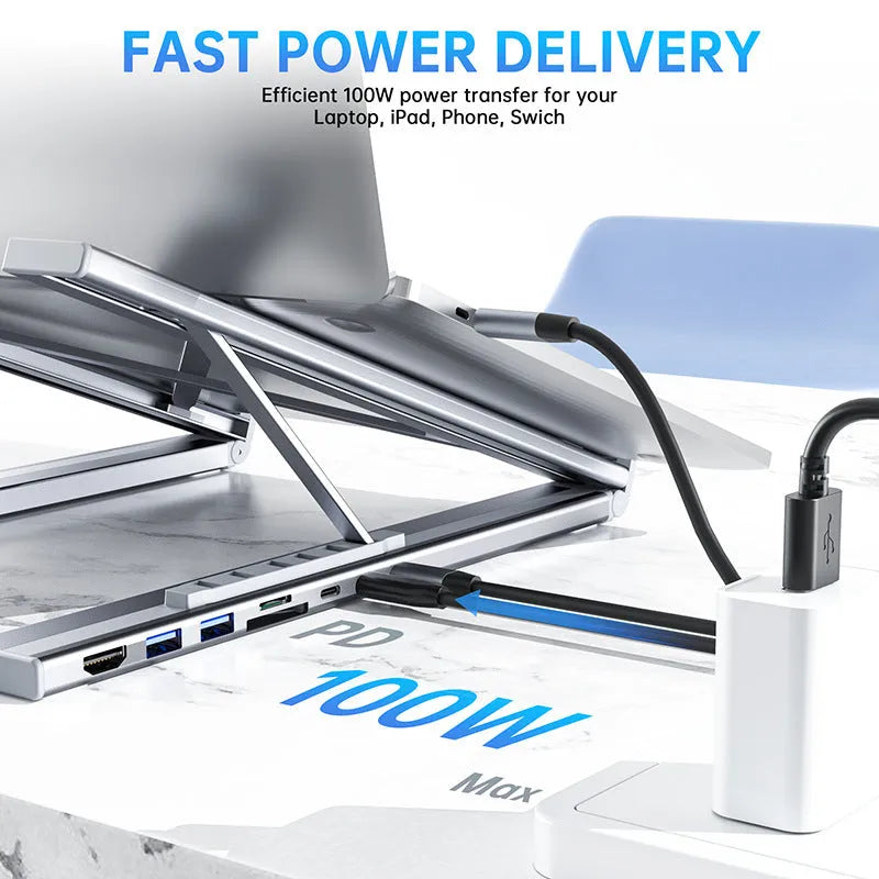 Aluminium folding laptop stand with integrated 8-in-1 docking hub showing ports and 0.6m cable