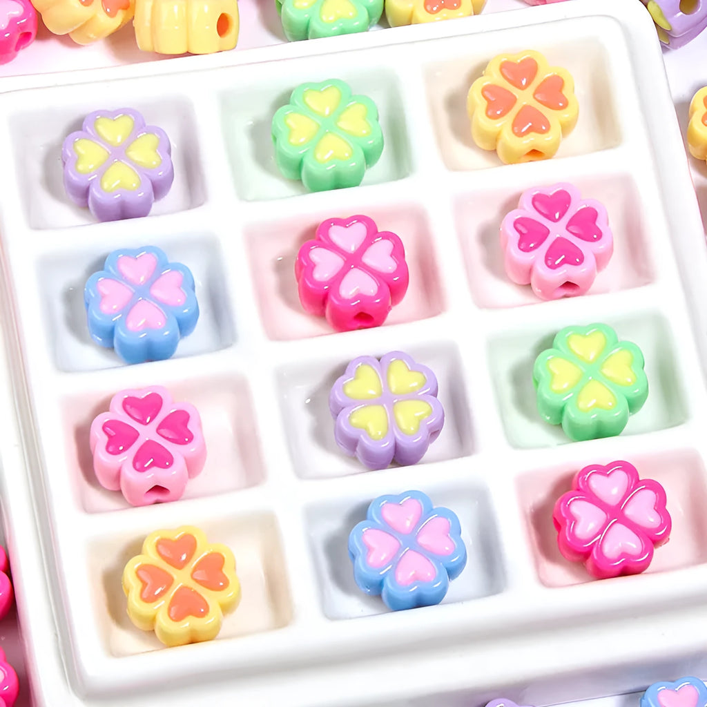 Acrylic four-leaf clover love beads with frosted finish in assorted light colours, 15mm size