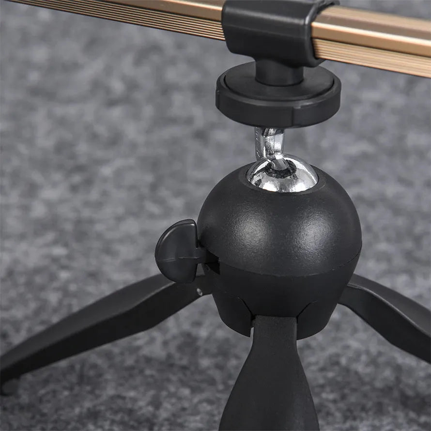 Aluminium ice fishing rod holder bracket with tripod legs supporting a small fishing rod