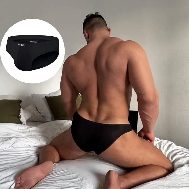 Men's low-waist seamless briefs in white, black, and pink solid colours showing hip-lifting design
