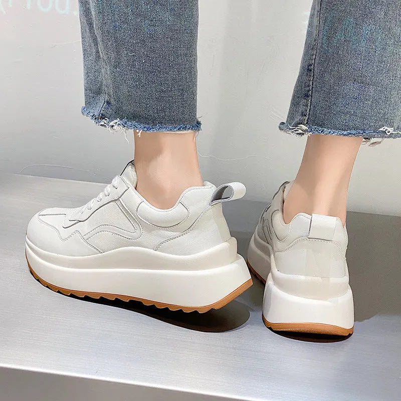 Women's white leather casual sports shoes with cross strap and English muffin heel detail