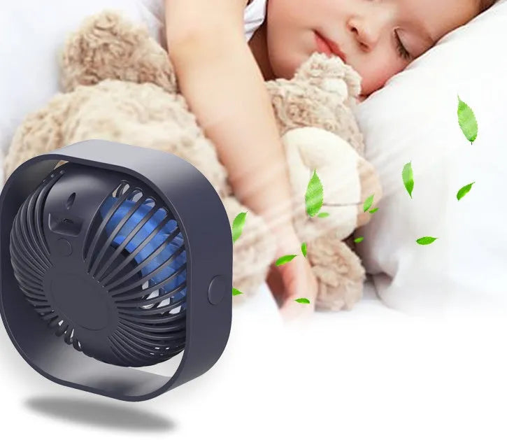 USB charging desk fan with alarm clock display in blue, showing 360-degree rotation capability.