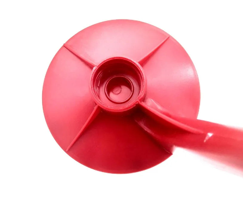 Red plastic Magic Tap soda bottle dispenser attached to a 2-litre bottle.